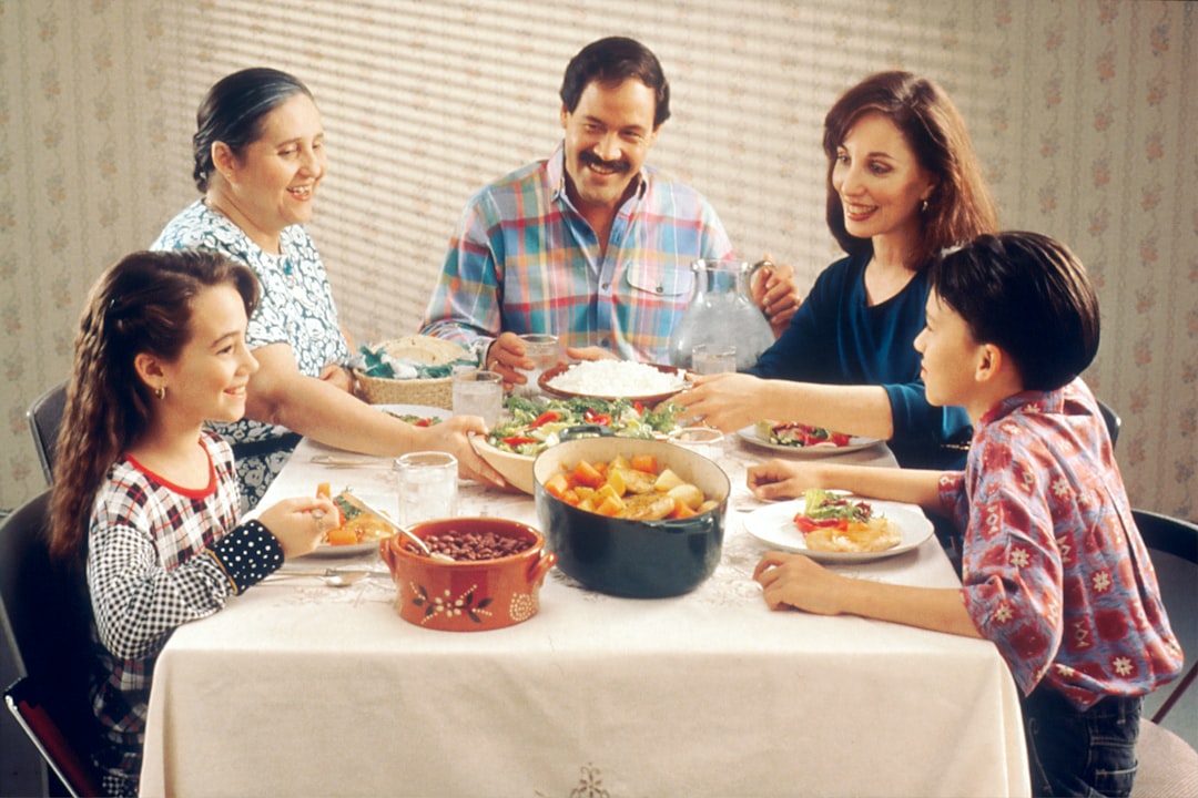Family sharing a meal together around a dinner table