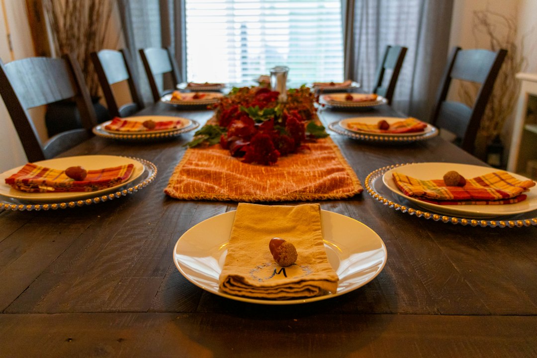 Rustic Thanksgiving dinner table setting ready for guests and holiday games